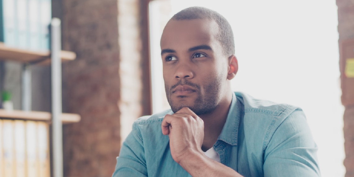 Photo of African American man thinking.