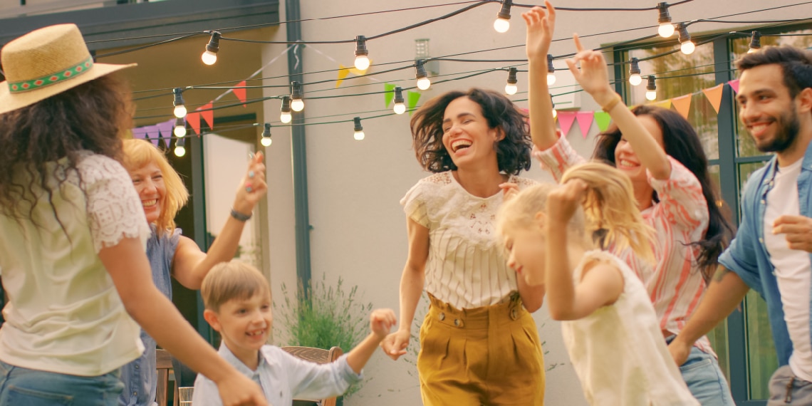 Photo of a family happily dancing together