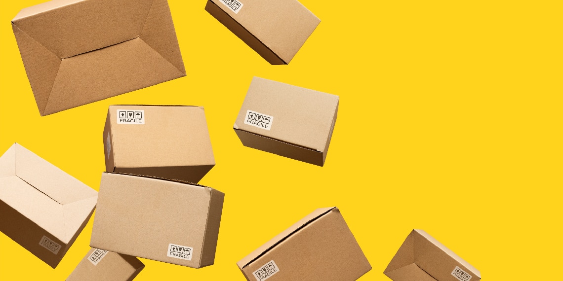 Delivery boxes floating against a bright yellow background.