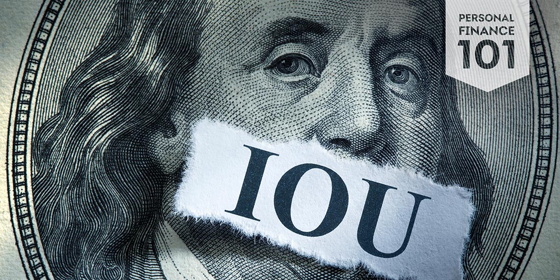 Ben Franklin from the hundred dollar bill with IOU taped across his mouth