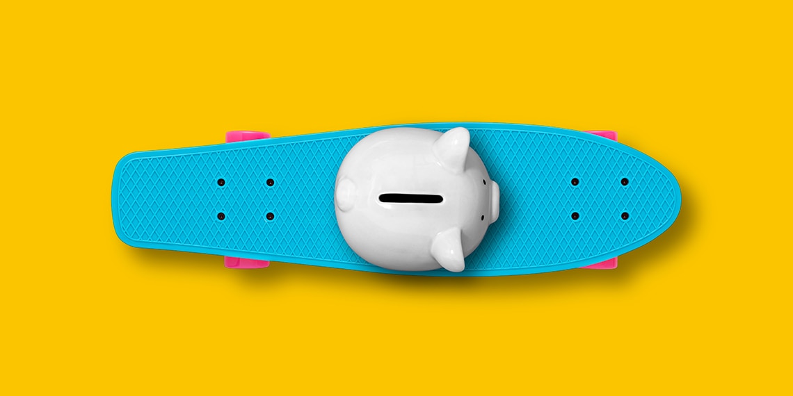 Piggy bank riding on a skateboard.