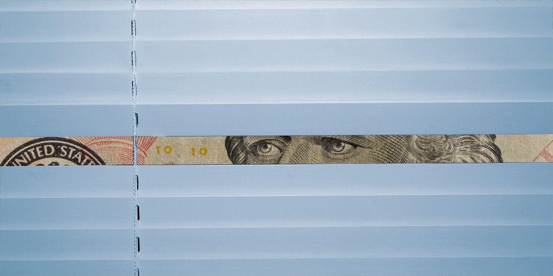 A ten dollar bill peeking through blinds.