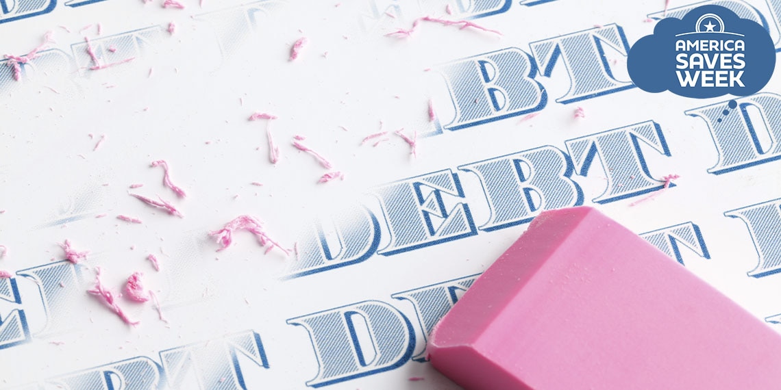 An eraser removing the word debt.